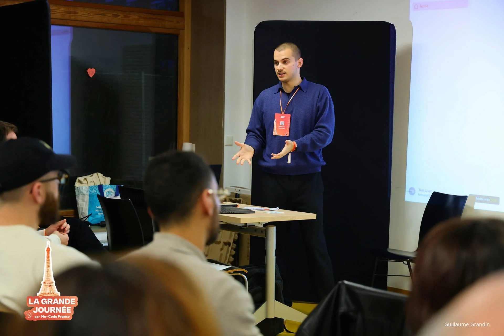 Guillaume speaking to a seated audience at La Grande Journée, No-Code France